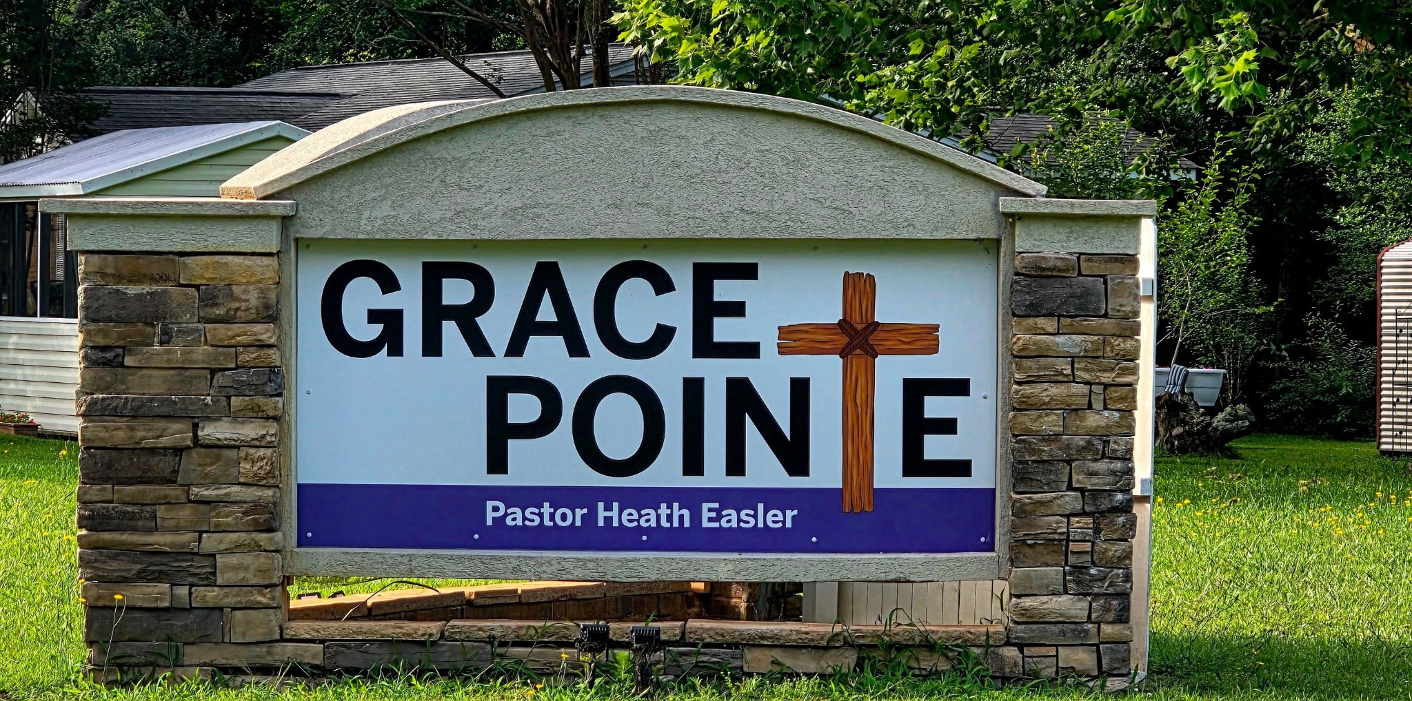 Grace Pointe church sign featuring a cross